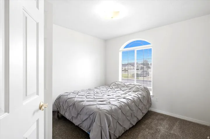 Arched window with horizontal blinds