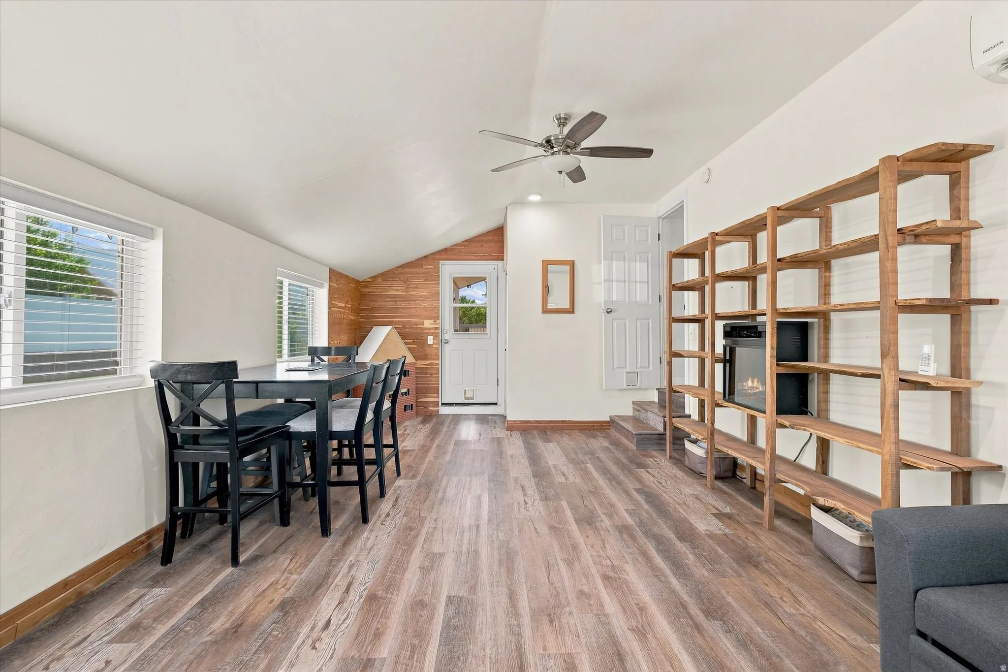 Wood-finish flooring, recessed lighting, and a ceiling fan