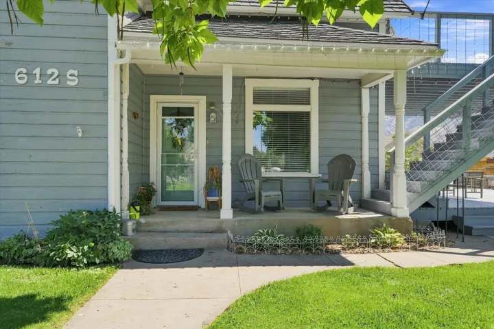 Front porch entry with light blue siding