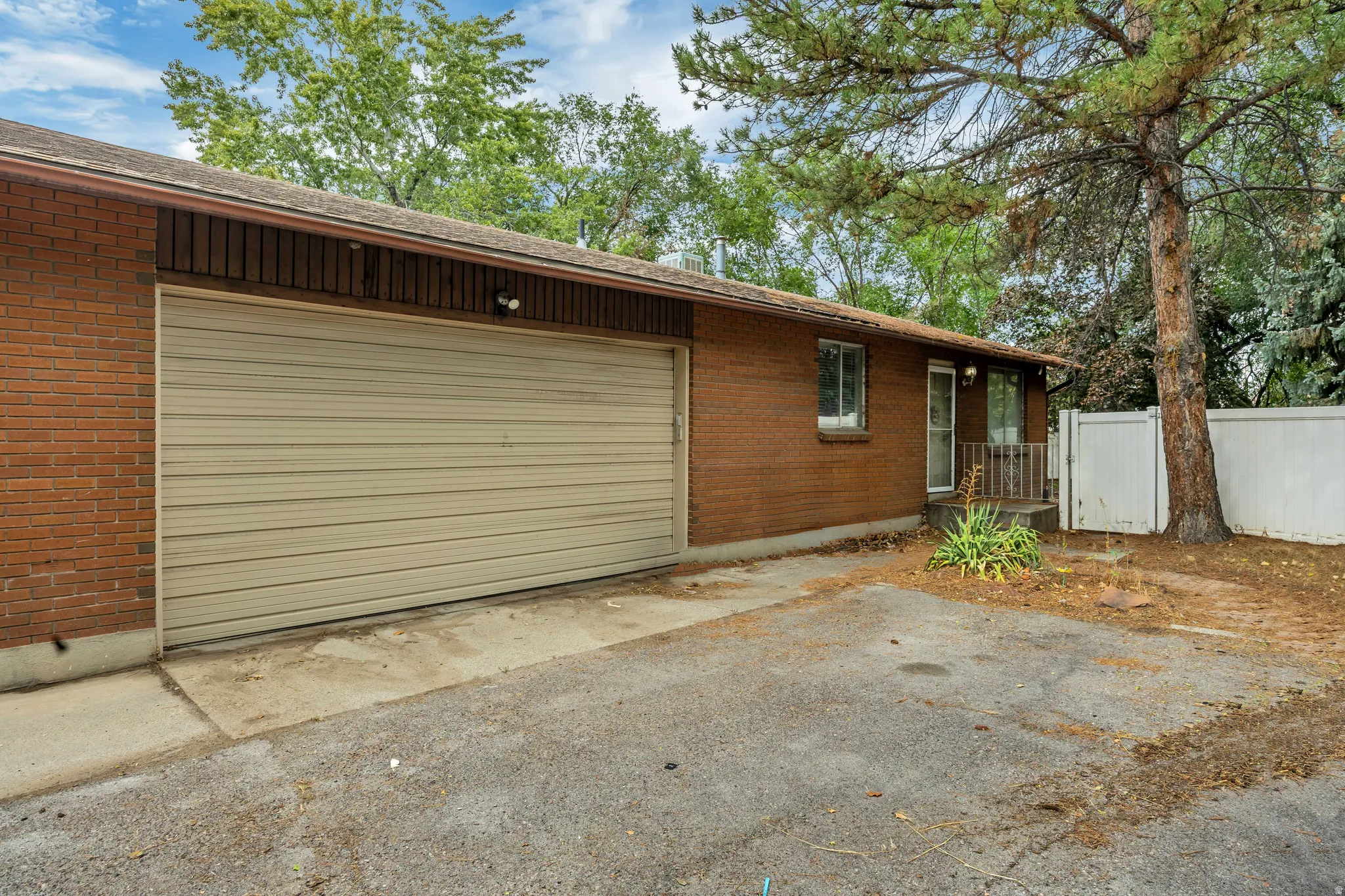 Unit 6709 - Brick exterior with a roll-up garage door