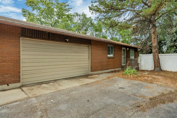 Unit 6709 - Brick exterior with a roll-up garage door