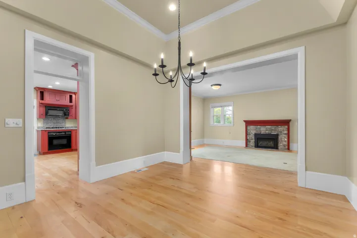 Wood-finish flooring with crisp white baseboards