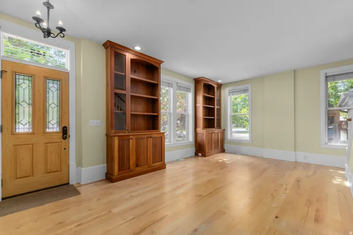 Light wood-finish flooring throughout the space