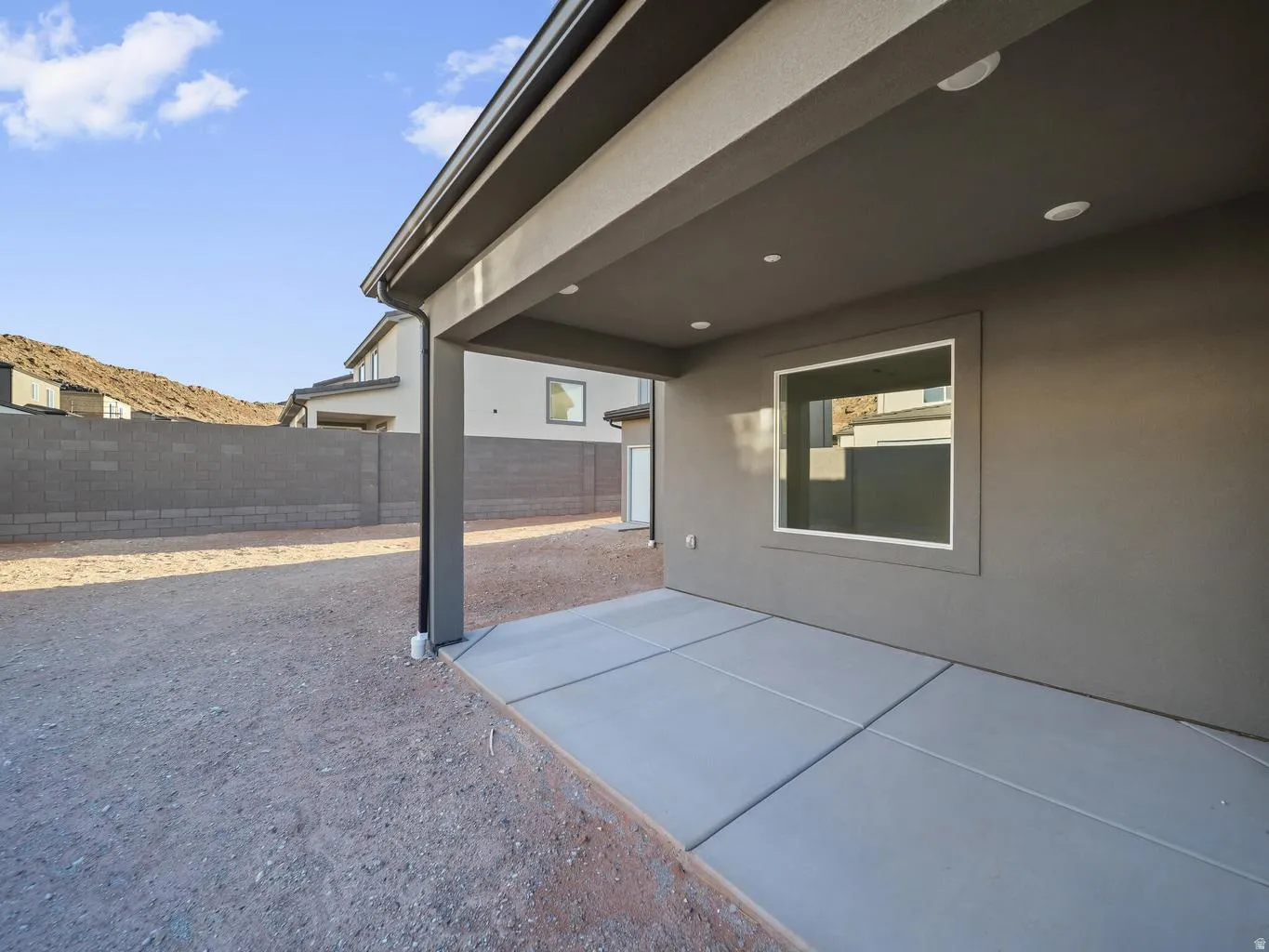 Covered patio with recessed lighting and a concrete slab