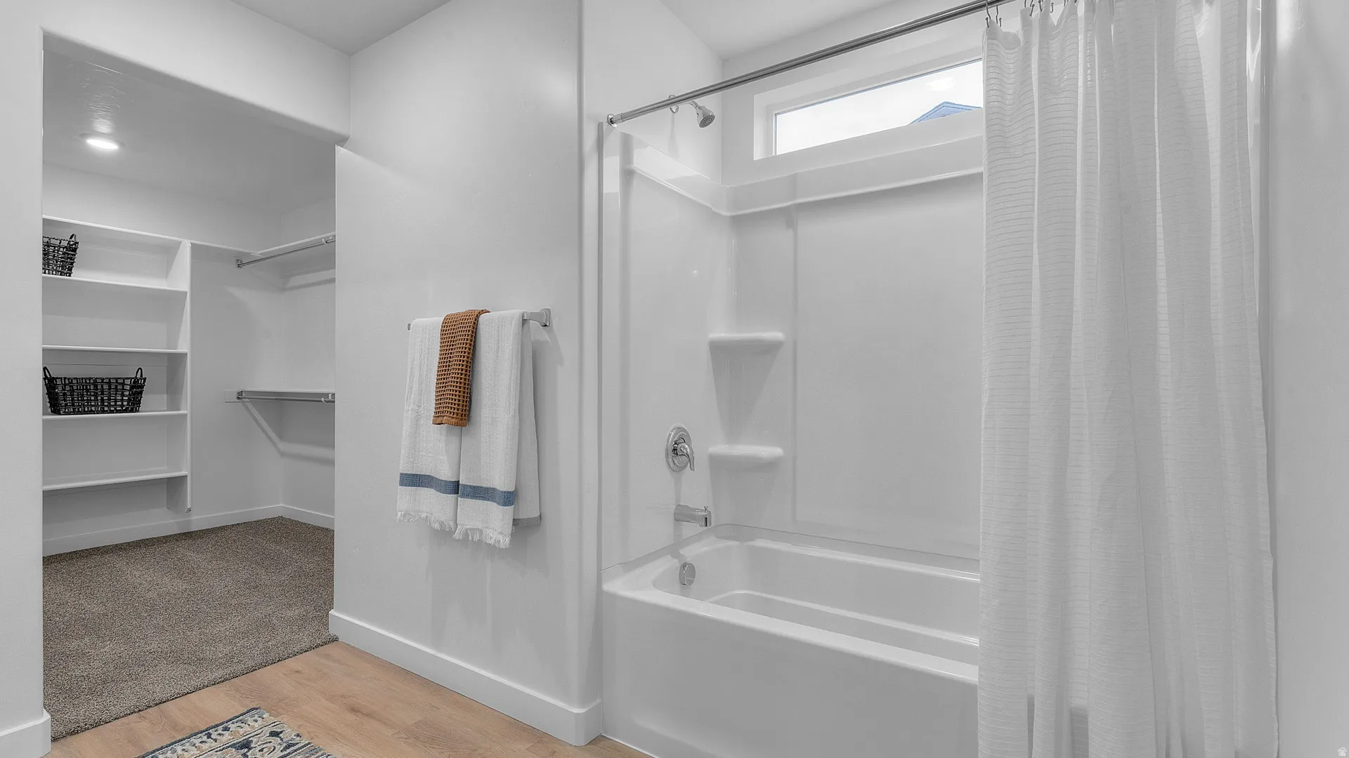 White shower-tub combination with an integrated window