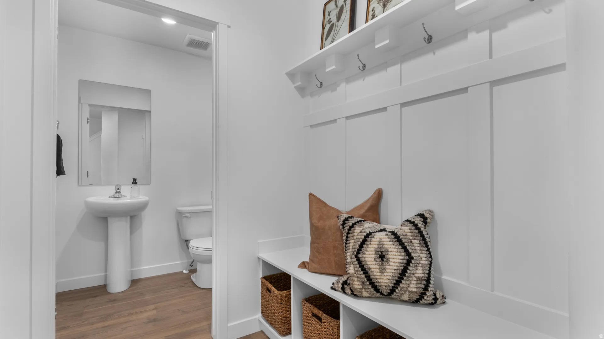 Built-in storage bench with woven basket cubbies