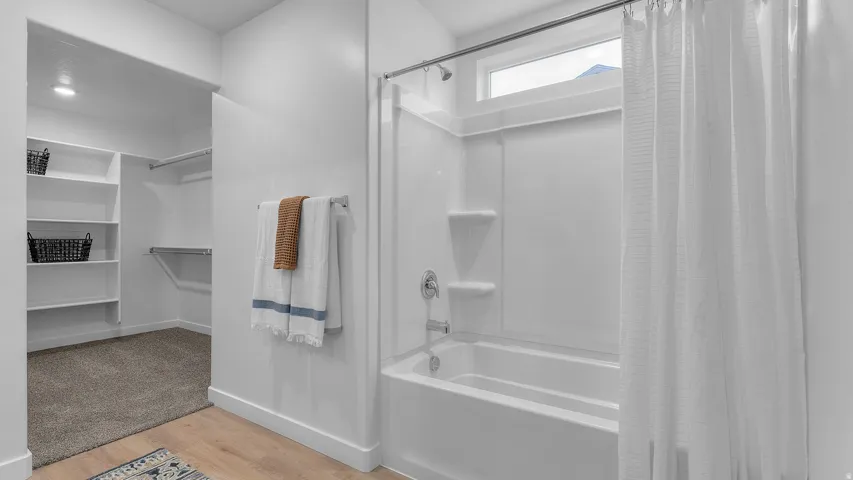 White shower-tub combination with an integrated window