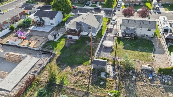 Spacious yard, RV parking, featuring a shed and mature landscaping