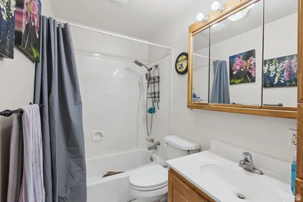 White porcelain bathtub and shower combination with a flexible shower head