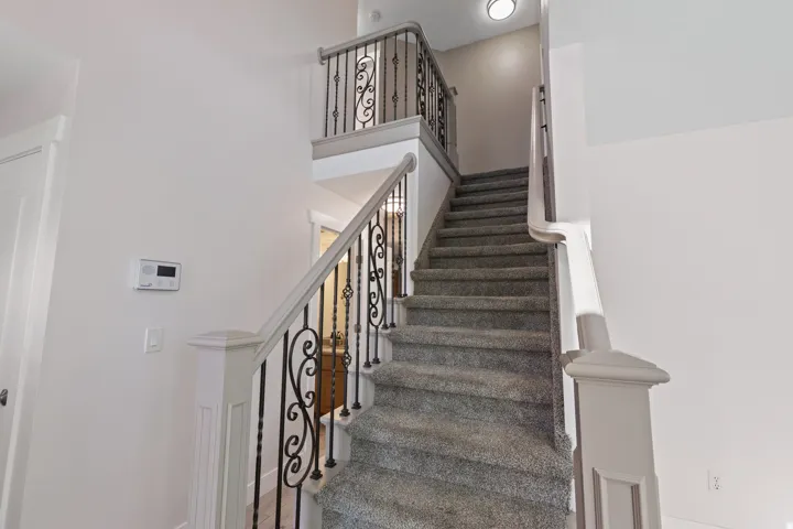 Beautiful Wrought Iron Staircase leading to the Upstairs