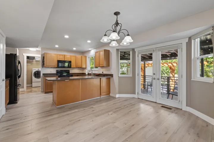 Dining Room. French Doors lead to Covered Deck with all the bells & whistles