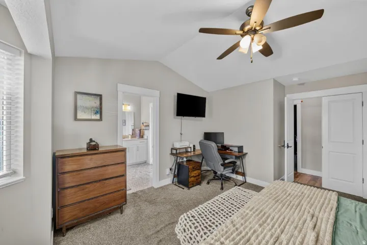 Vaulted ceiling with a ceiling fan
