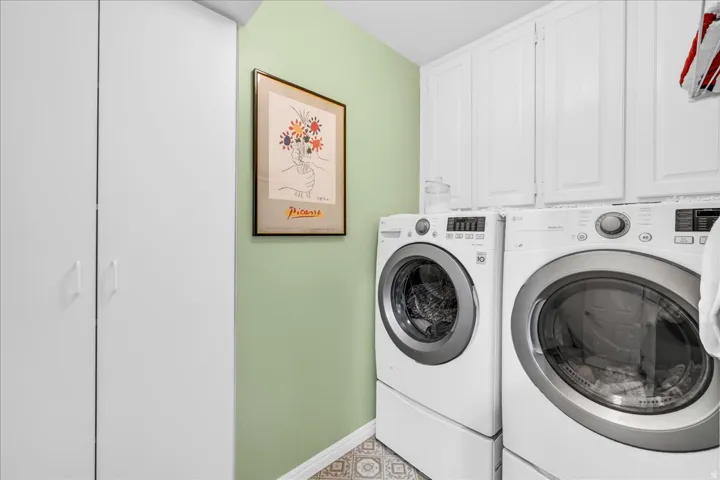 White cabinetry providing overhead storage