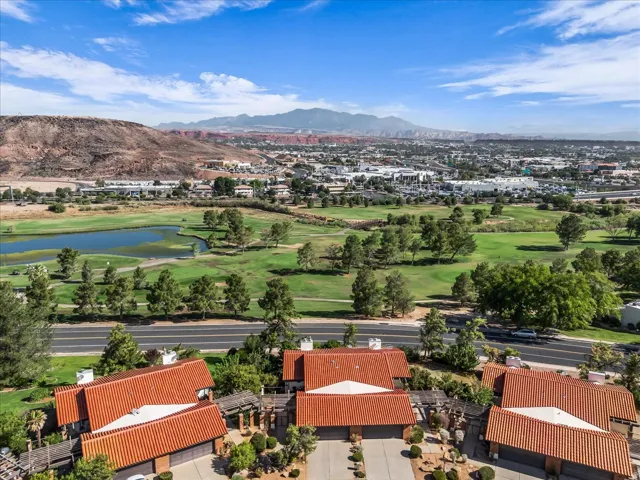 Terracotta tile roofs with surrounding mature trees and a desert-inspired landscape