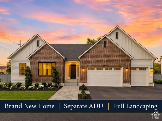 Brick and siding exterior with a dark roof and white trim