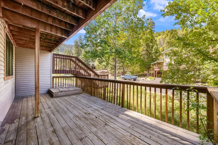 Wood deck with wood railing and integrated steps