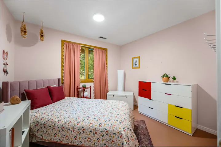 Middle level second bedroom. Recessed ceiling light fixture