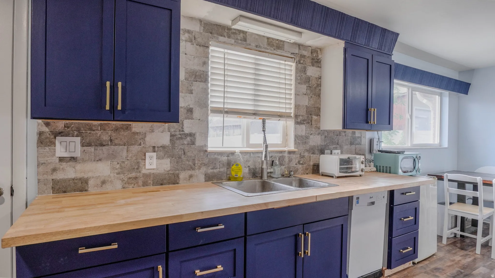 Navy blue cabinetry with gold-tone hardware