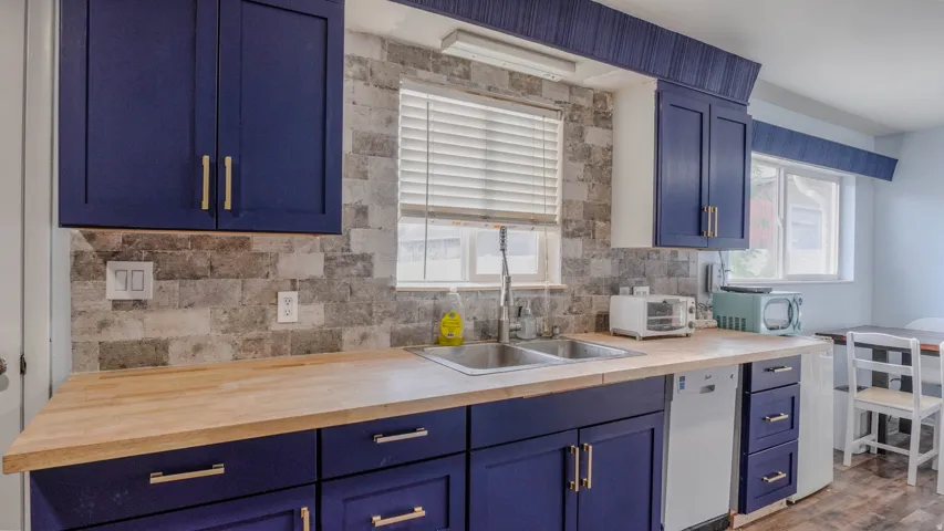 Navy blue cabinetry with gold-tone hardware