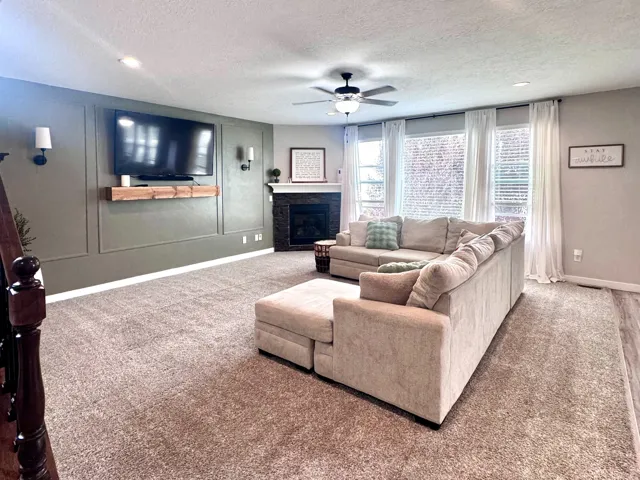 Recessed ceiling lighting, wood-finish flooring, and wall-to-wall carpeting