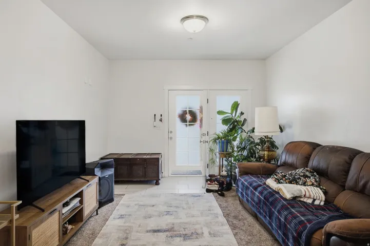White walls and ceiling with a flush-mount ceiling light