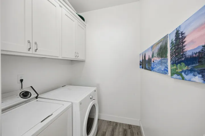 White upper cabinetry with brushed nickel pulls