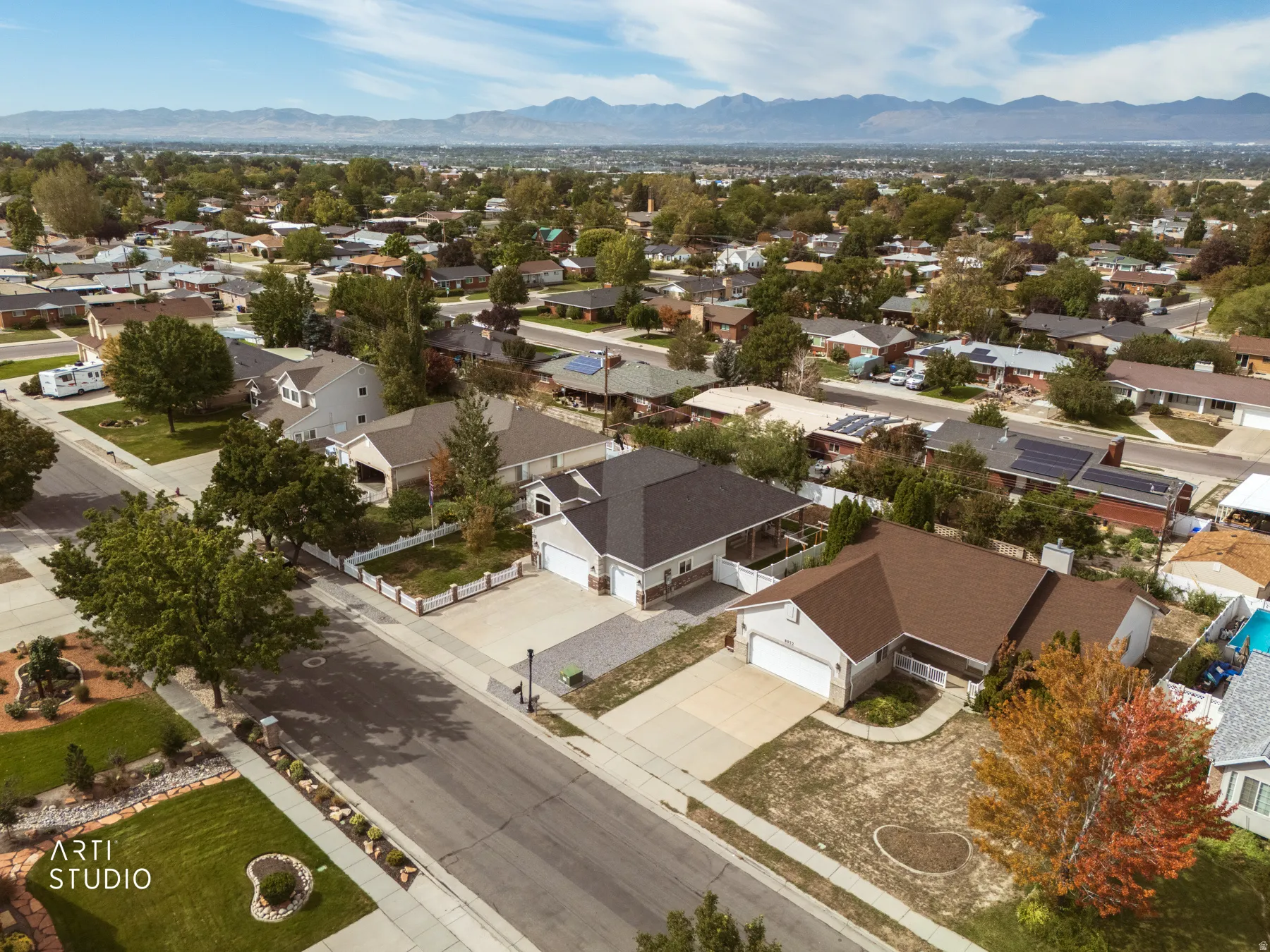 Aerial view of a residential neighborhood with mountain backdrop
