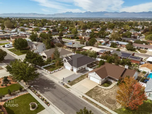 Aerial view of a residential neighborhood with mountain backdrop