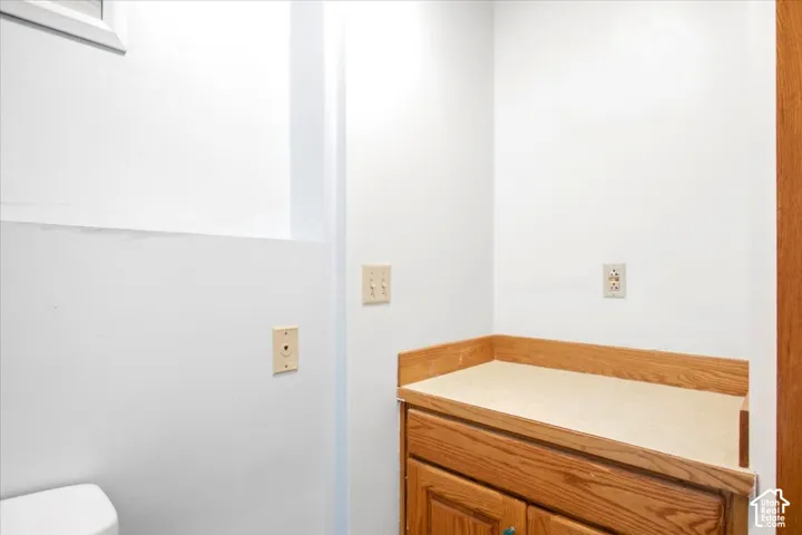 Built-in wood-finish cabinetry featuring a light-toned countertop