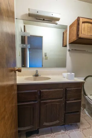 Vanity with an integrated sink and base cabinetry