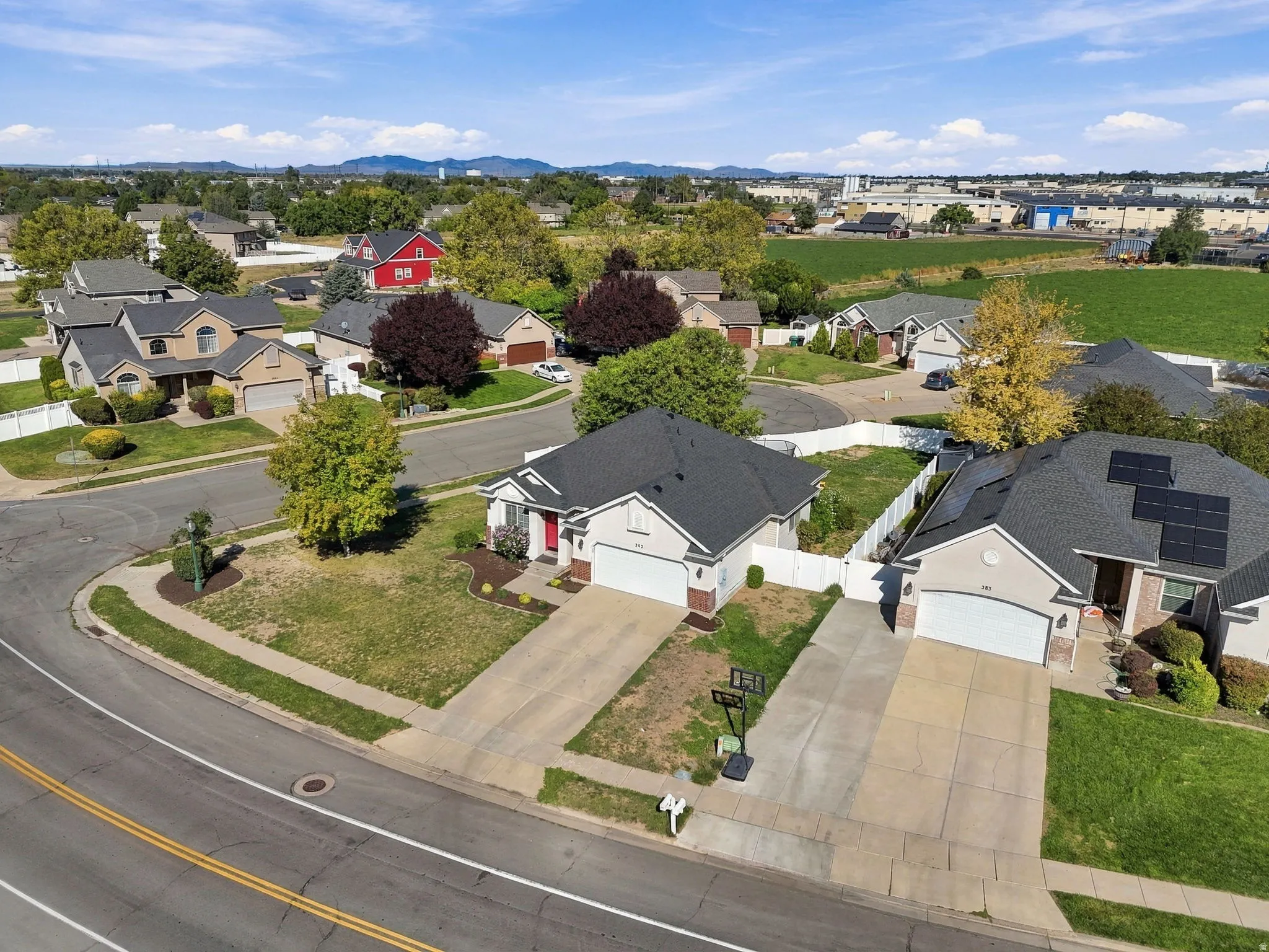 Residential neighborhood setting with concrete driveways