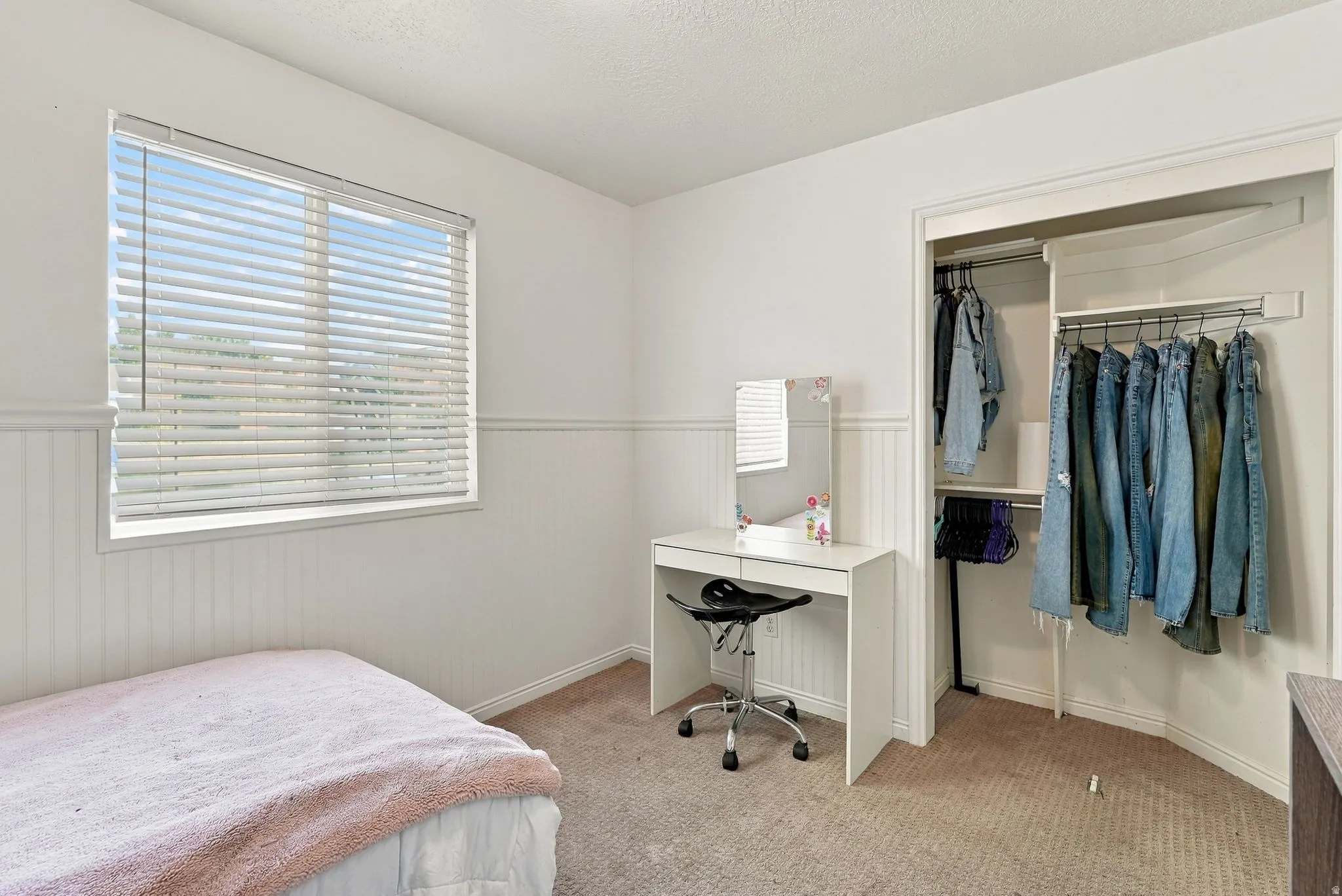 Built-in closet with hanging rods and shelving