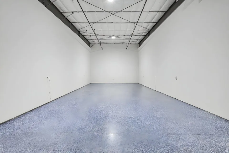 Spacious interior with high ceilings and exposed structural beams