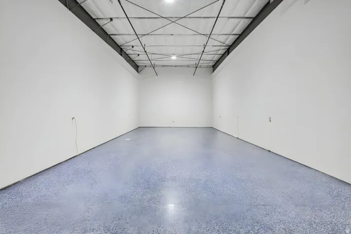 Spacious interior with high ceilings and exposed structural beams