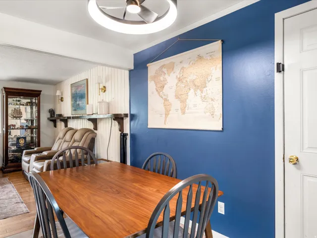 Wood-finish flooring with an overhead ceiling fan