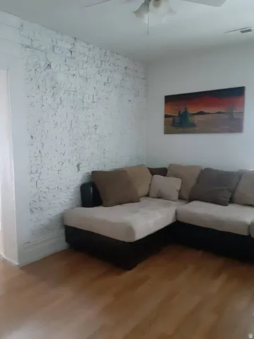 White painted exposed brick wall accent