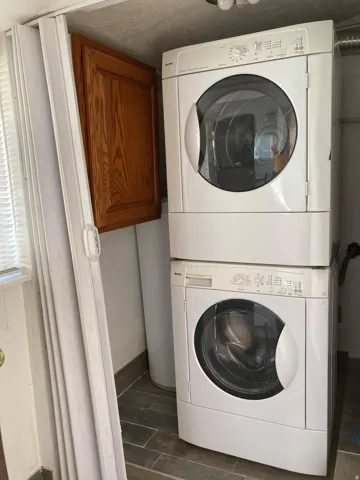 Stackable laundry appliances and wood-finish cabinetry