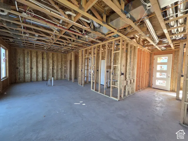 Wood frame construction featuring exposed ceiling joists and wall studs