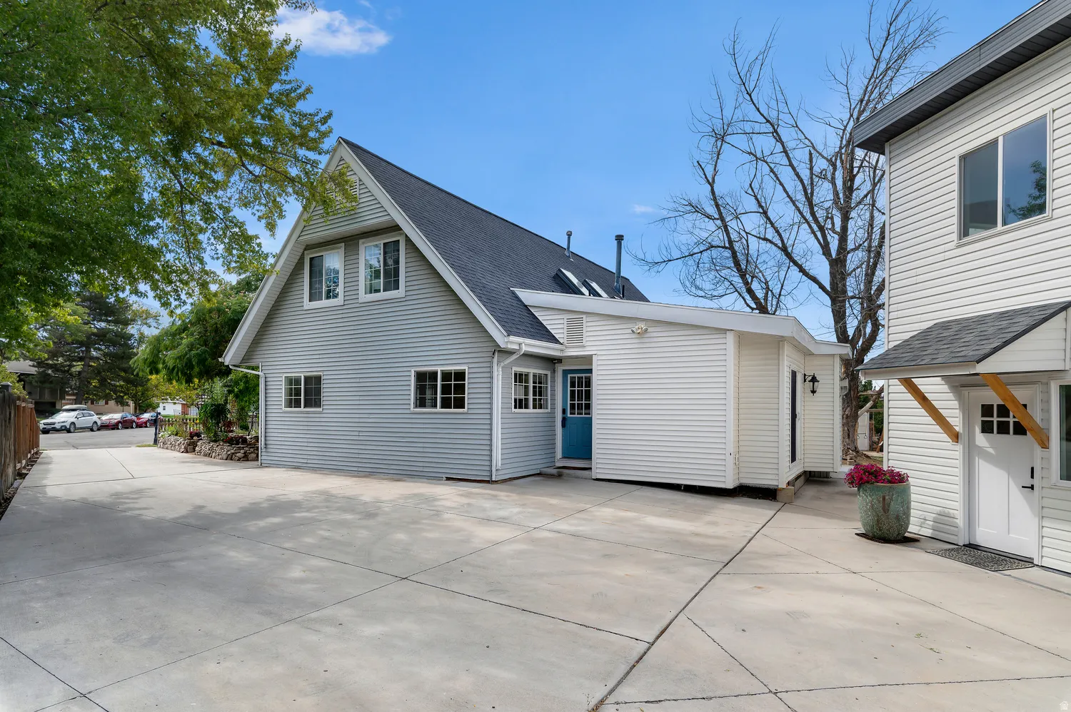 Spacious concrete driveway featuring ample parking