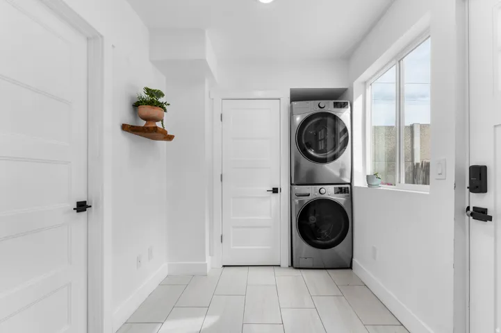 Guest house entry with closet and laundry equipment