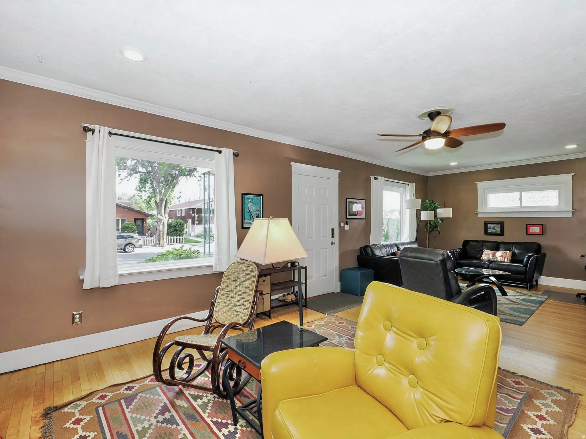 Hardwood flooring, recessed lighting, crown molding, white trim, and a ceiling fan