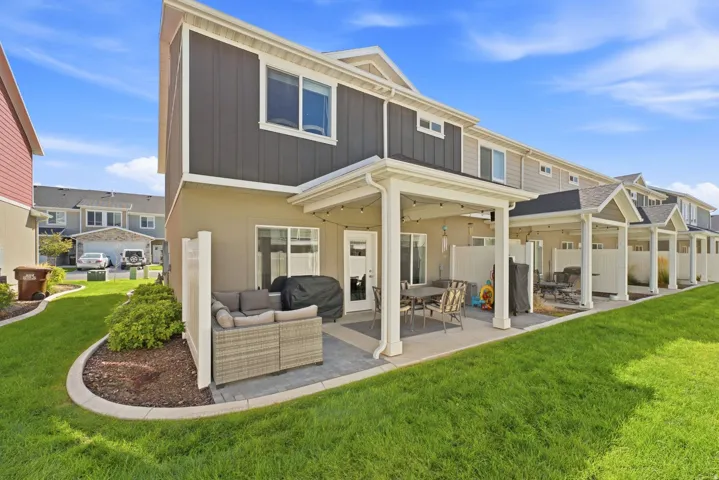 Patio with a covered pergola, privacy fence, and paved surface