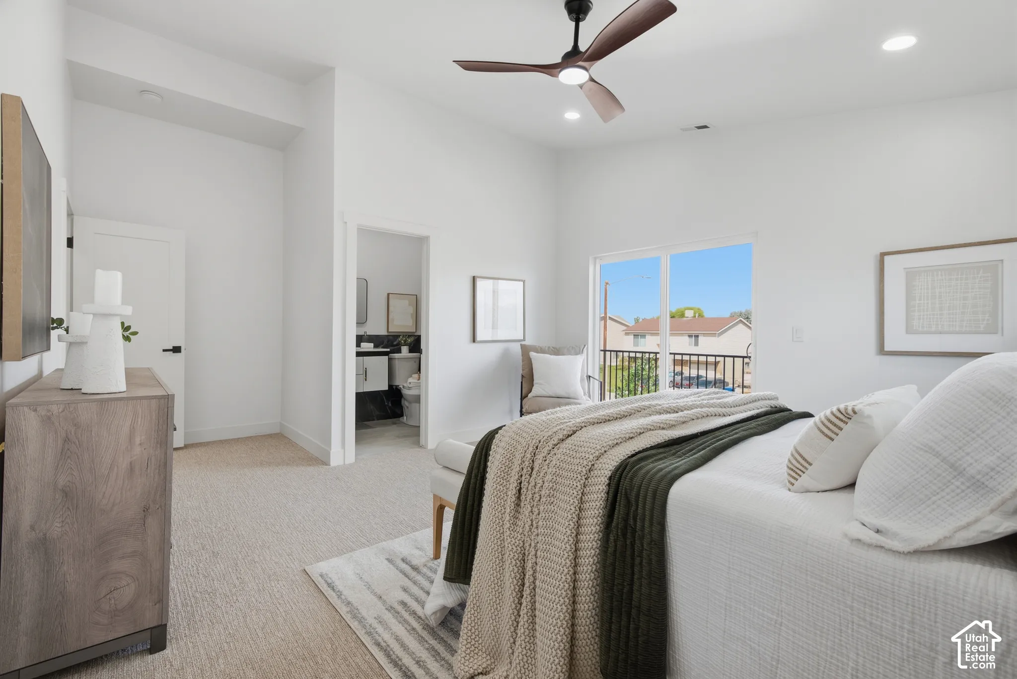 Vaulted ceiling with a ceiling fan, recessed lighting, sliding glass door with balcony access, and plush carpeting