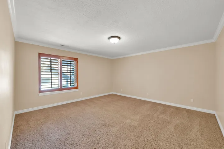 Recessed window with wood-finish plantation shutters