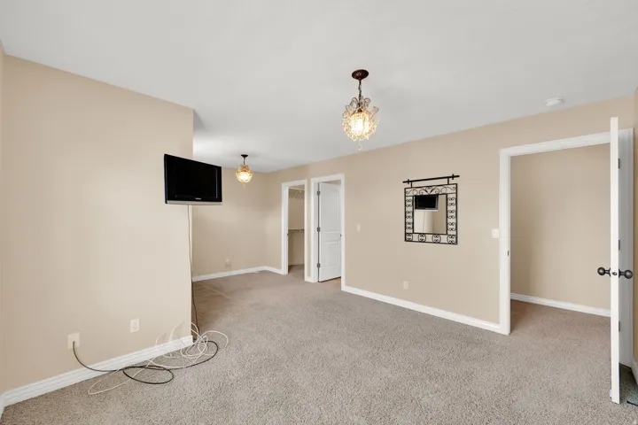 Neutral-toned carpeting paired with light beige walls
