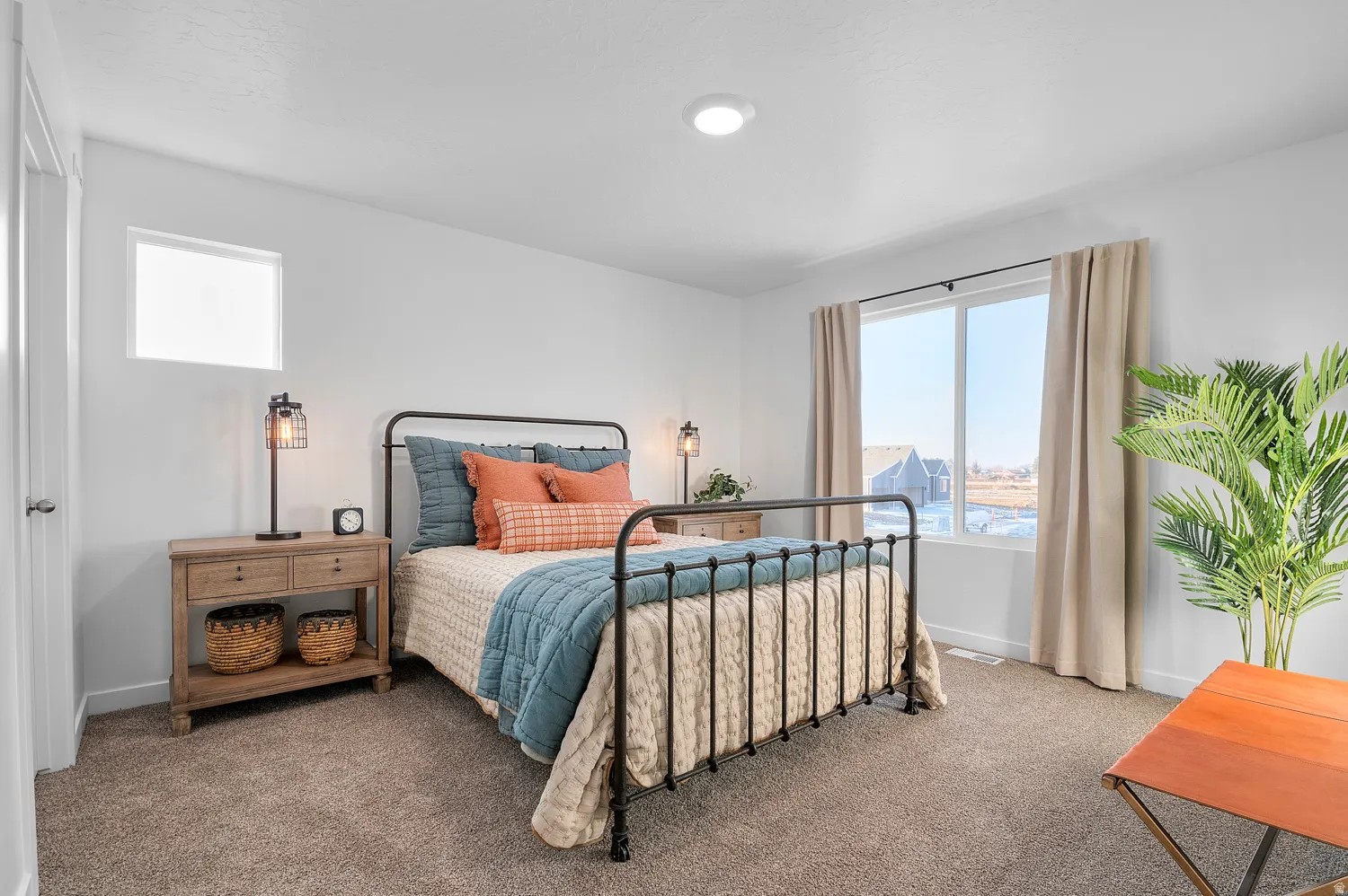 Carpeted flooring, recessed ceiling lighting, and multiple windows providing ambient light