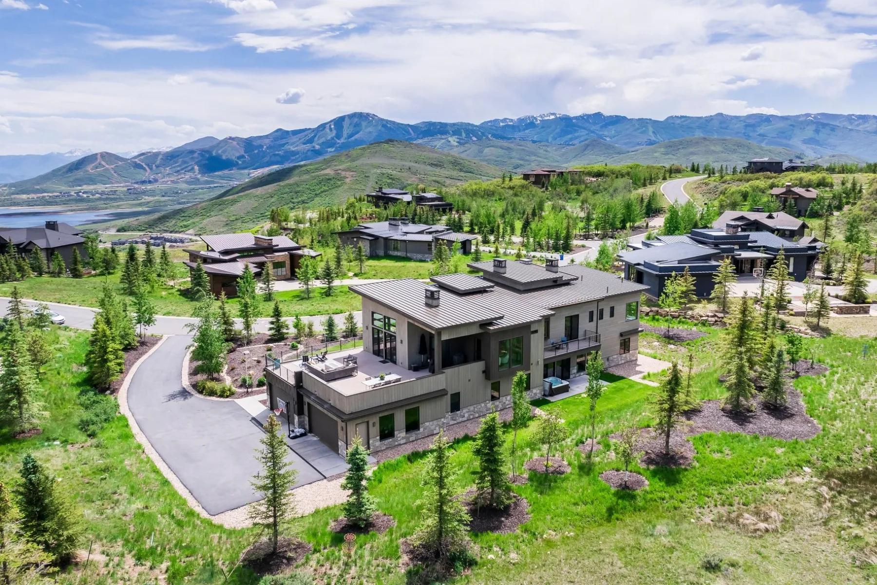 Contemporary residence with a flat roof design, expansive windows, and multiple outdoor terraces