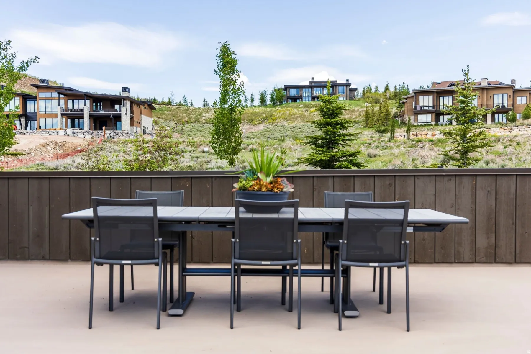 Expansive outdoor patio with a privacy fence