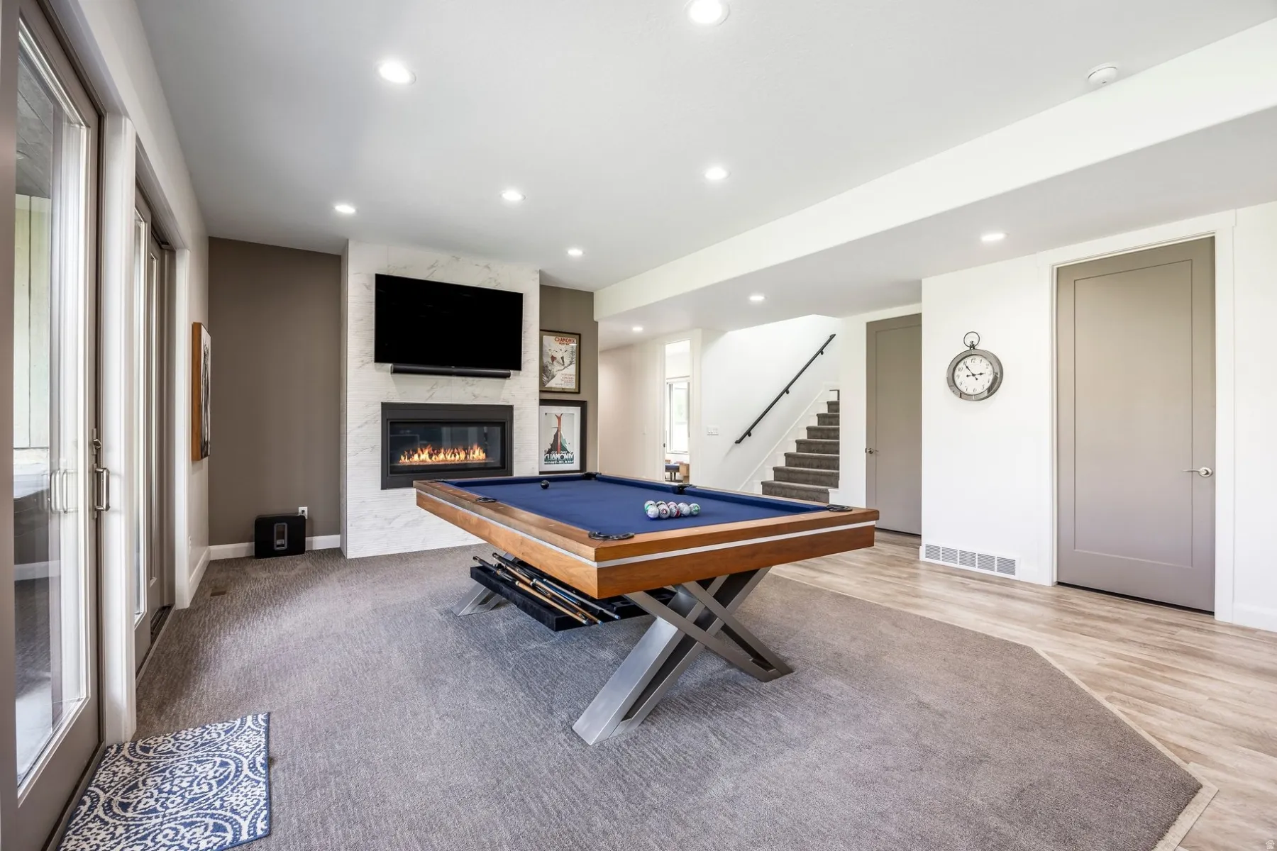 Recessed lighting, wood-finish flooring, and carpeted areas