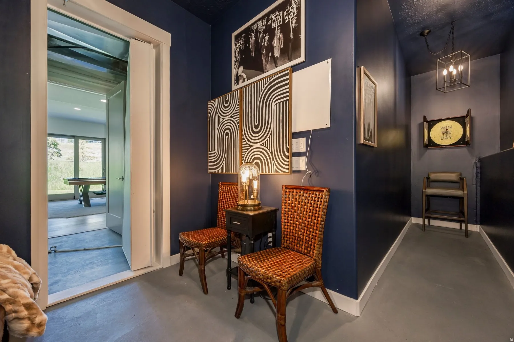 Dark-toned walls throughout, entryway with a full glass-panel door, and recessed lighting